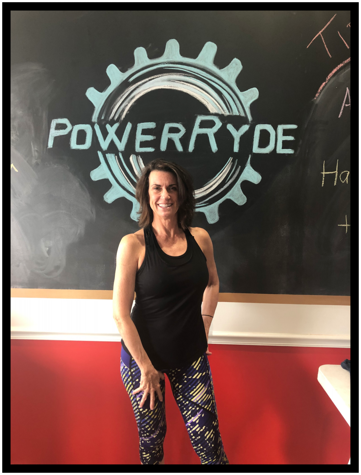 Anne Neuville in front of chalk PowerRyde logo
